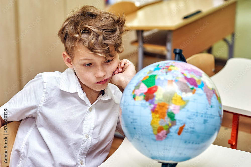 Portrait of a thoughtful elementary school student in class Portrait of a thoughtful elementary school student in class