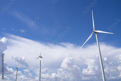 The wind turbines used to generate electricity provide clean energy to the earth on clear days