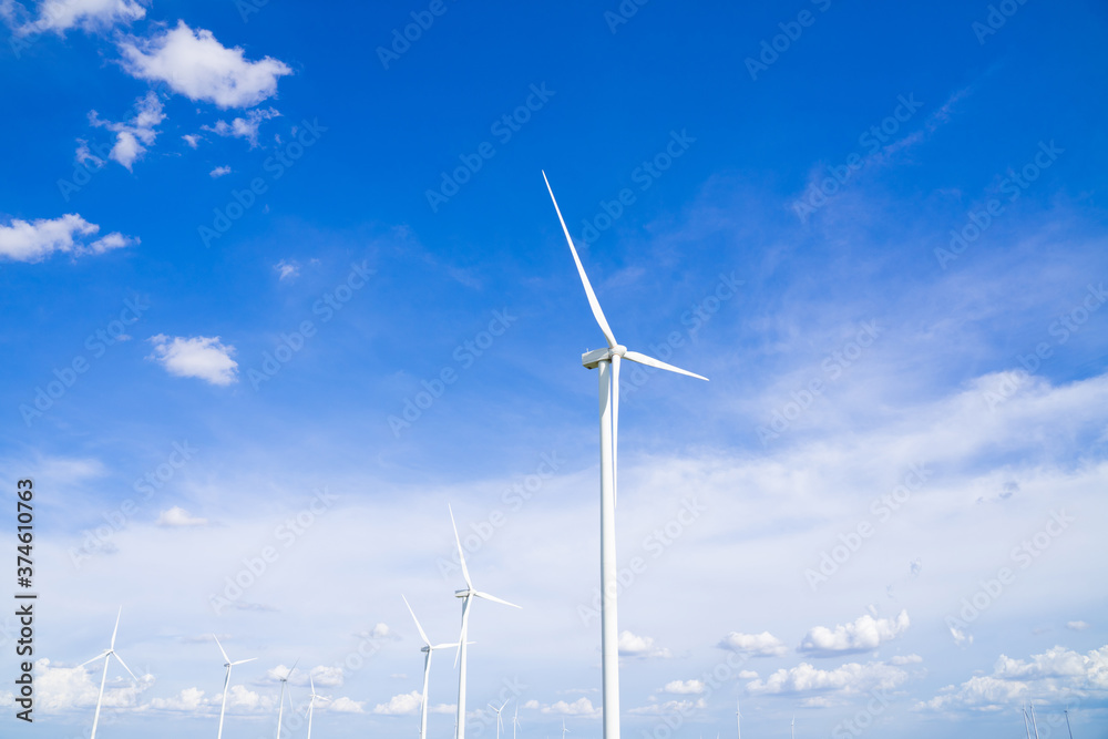 The wind turbines used to generate electricity provide clean energy to the earth on clear days The wind turbines used to generate electricity provide clean energy to the earth on clear days