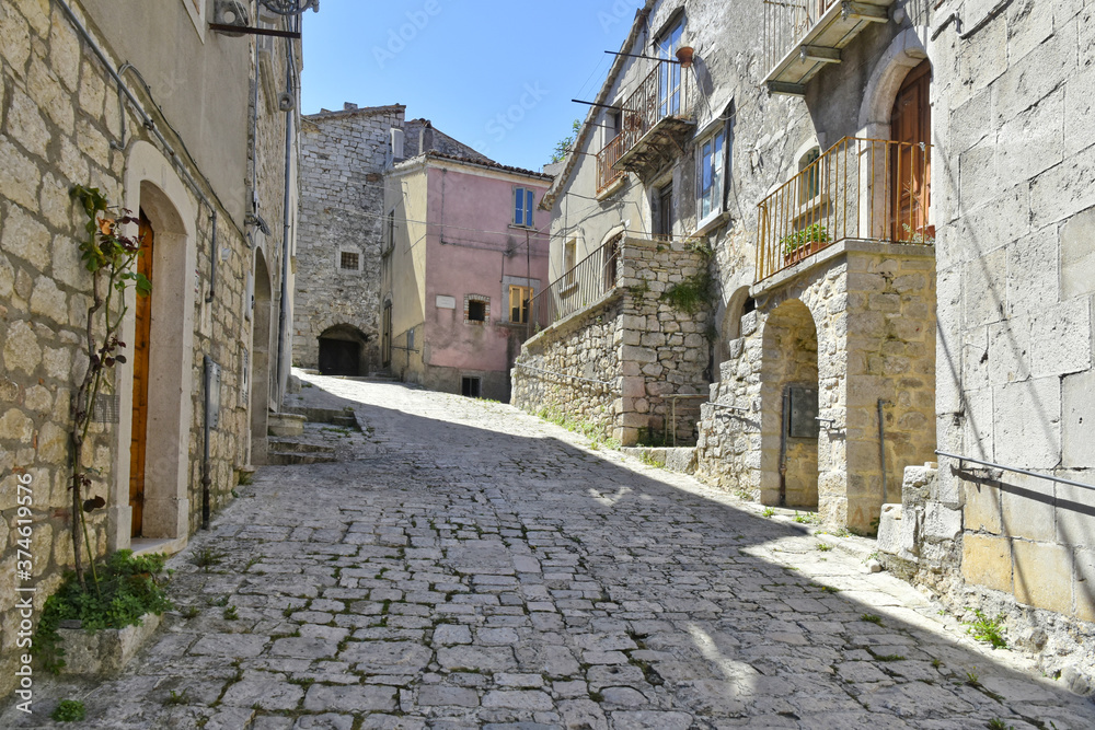 A narrow street among the old houses of Riccia, a rural village in the Molise region.