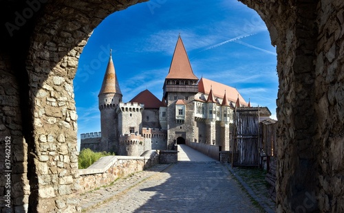 Summer view from a tunnel on Corvin castle in a sunny day in Romania.