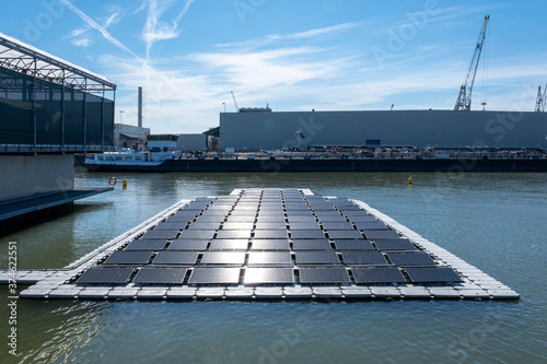 solar panel Floating in a harbour. Used to produce electricity in a clean technology concept photo