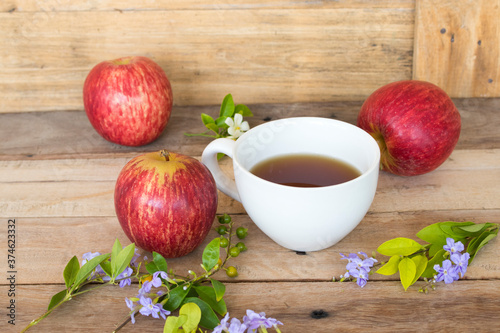 background texture super fruits red apple healthy foods for diet with flower  hot tea arrangement flat lay style on wooden