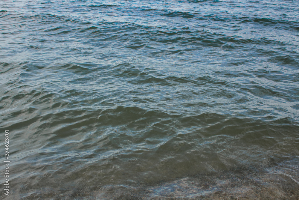 Fototapeta premium sea water on the shore and clear sky