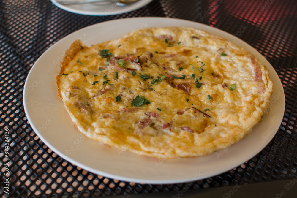 omelet with vegetables on a plate on the table omelet with vegetables on a plate on the table