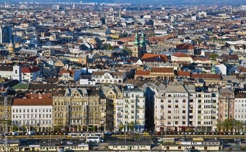 Aerial cityscape in Budapest, one of the largest cities in EU. Photo was taken from Citadella in Budapest, Hungary. Nice houses roofs and the road with high traffic on the foreground.