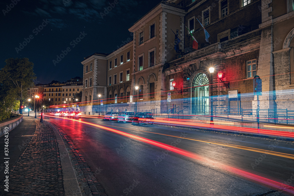 Long exposure photography of night traffic in the city of Rome Italy