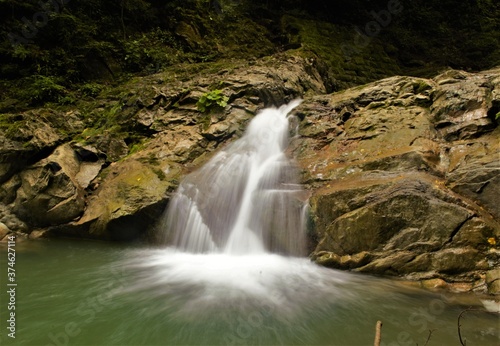 Fototapeta Naklejka Na Ścianę i Meble -  
beautiful place in the mountains with a waterfall