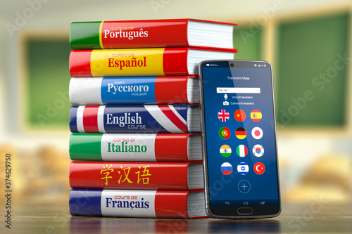 Mobile dictionary, translator  and e-learning.concept . Learning languages online.  Smartphone and books with language courses. photo