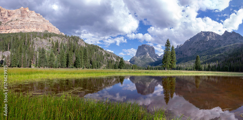 An enormous High resolution panorama of Square top mountain reflecting in a small pond near the headwaters of the Green River, in the wind river range Wyoming.