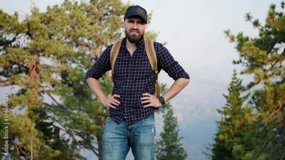 Portrait of a travel videographer standing on a hill in Yosemite National Park Portrait of a travel videographer standing on a hill in Yosemite National Park
