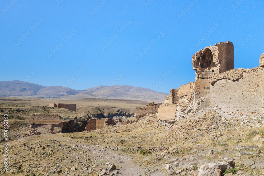 Ruins of walls & buildings of medieval city Ani, near Kars, Turkey. City founded in 5 century by Armenians. After series of conquests & earthquake it was abandoned. It's UNESCO object