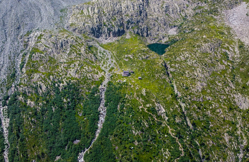 Aerial view of Denza refuge and the alpine Denza lake (Presanella lake) in the Adamello - Presanella group, Vermiglio in Trentino Alto Adige, northern Italy, Europe. Italian alps