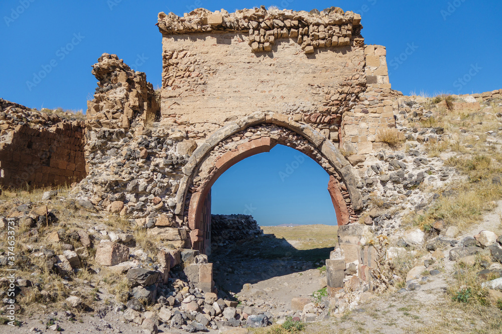 Remains of city gates & walls in ancient medieval city Ani, near Kars, Turkey. City was founded in 5 century by Armenians, abandoned in 17 in Ottoman times, now included in UNESCO List
