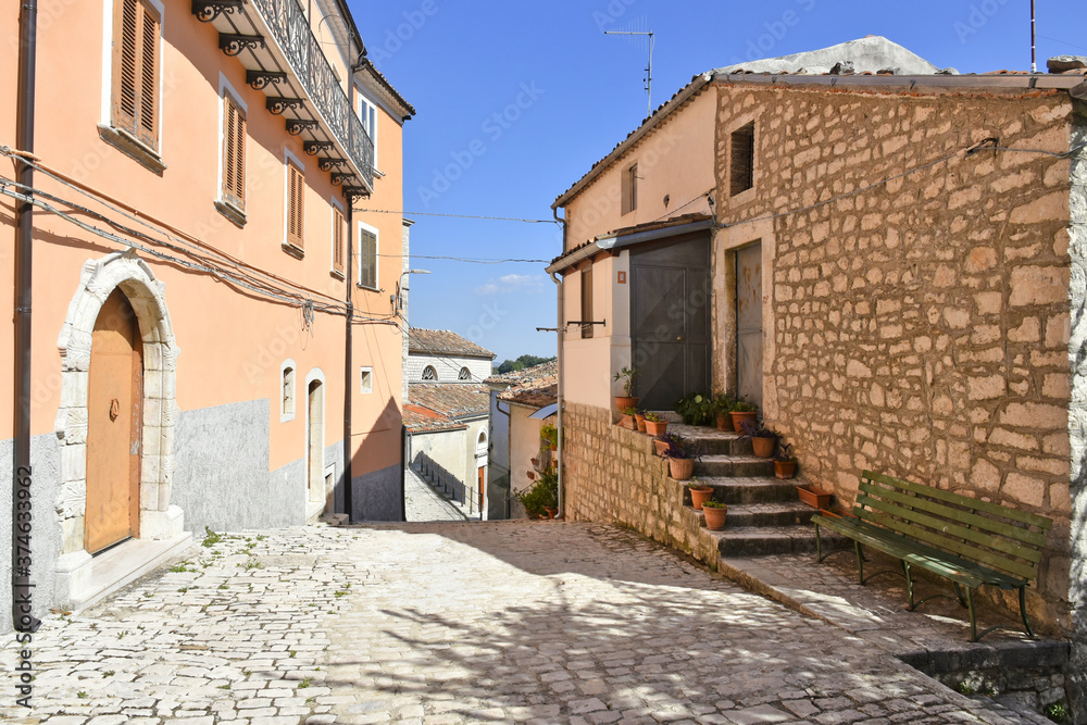 A narrow street among the old houses of Sepino, a medieval village in the Molise region.