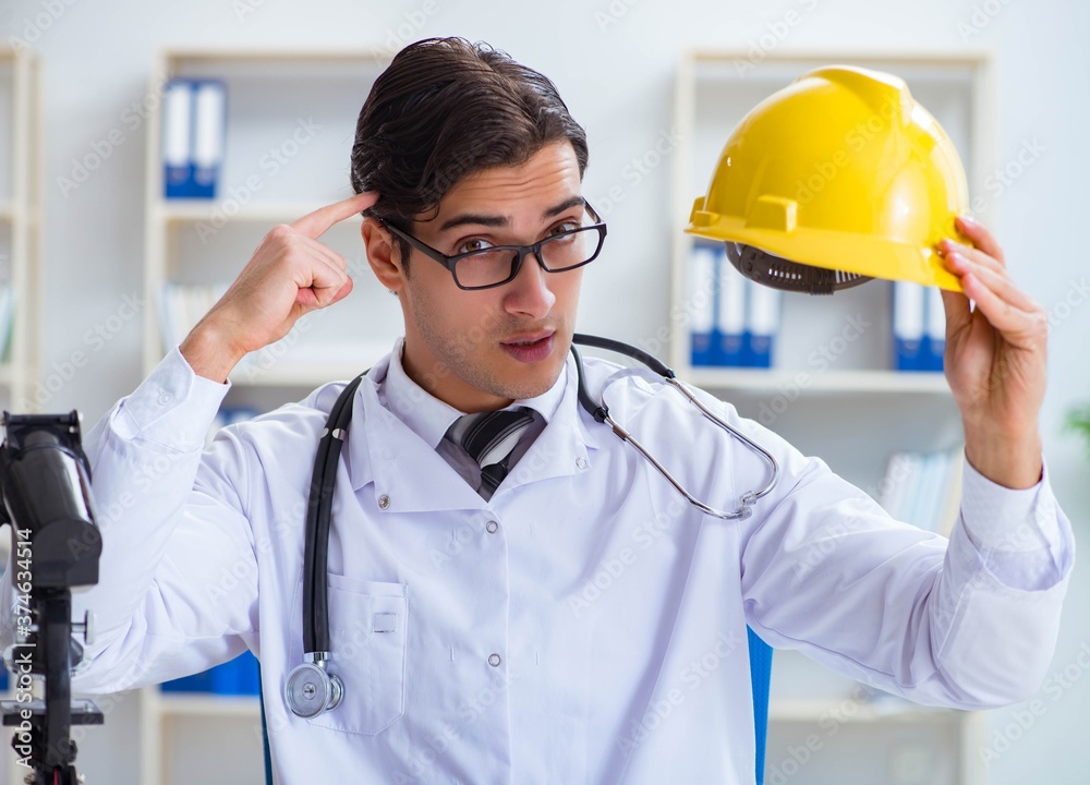 Safety doctor advising about wearing hard hat Safety doctor advising about wearing hard hat