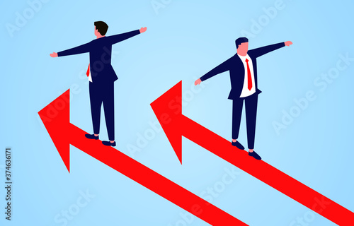 One businessman follows the arrow to go up, another businessman goes down in the opposite direction of the arrow