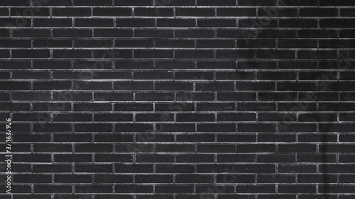 Black brick wall  the shadow of the tree. Background texture
