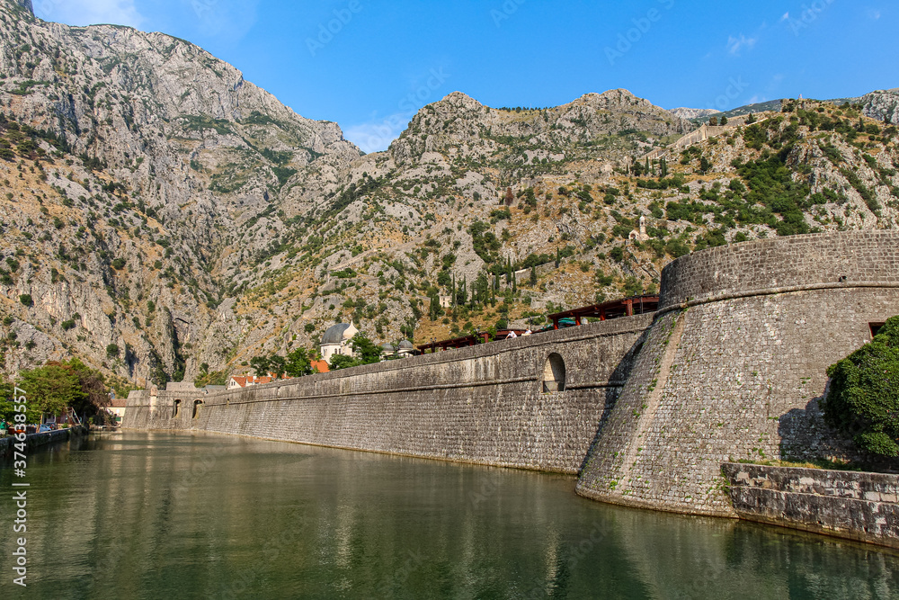 The Kampana Tower and city walls of the Old Town of Kotor, Montenegro The Kampana Tower and city walls of the Old Town of Kotor, Montenegro