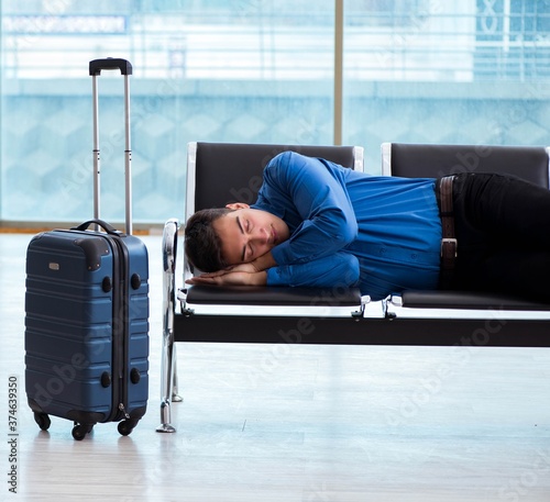 Man wairing to boarding in airport lounge room photo