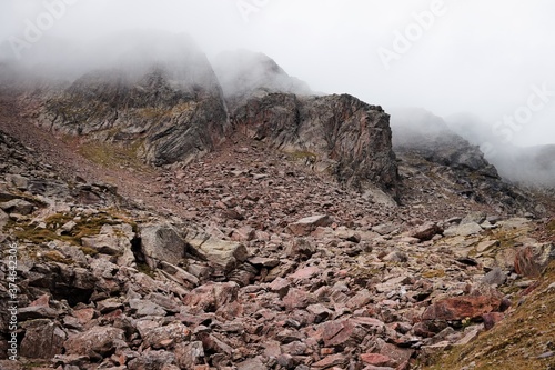 View of Mount Vioz in a foggy day with  mist and clouds (Trentino, Alps, Italy, Europe) photo