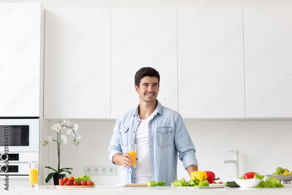 Young man cooking in modern kitchen, preparing breakfast. Young man cooking in modern kitchen, preparing breakfast.