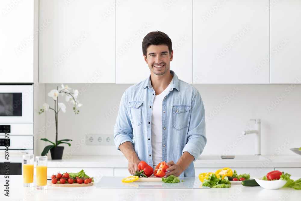 Man preparing delicious and healthy food in the home kitchen. Man preparing delicious and healthy food in the home kitchen.