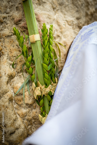 Jewish man in Tallit prayer shawl holding the 