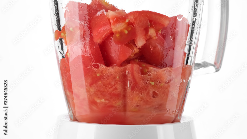 grinding piece of tomatoes in blender Stock Photo Adobe Stock