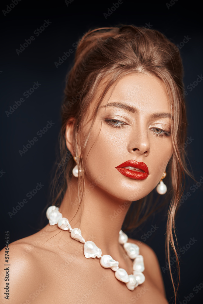 white jewelry and red lips