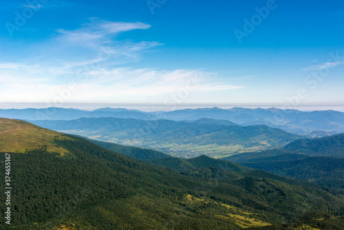 Traveling by the Carpathians. Polonyna Runa, Gostra, and other peaks. Spring, Summer and Autumn rest in the Carpathians. Green, Blue colors. Forest and meadows. photo