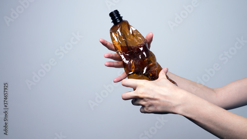 Photo of hands holding bottles