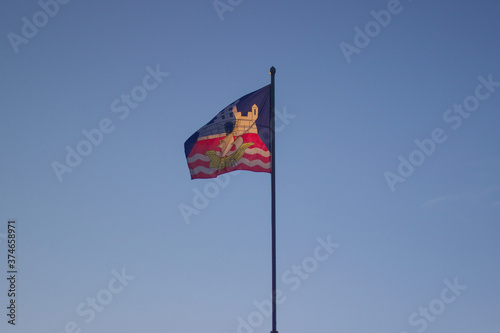 The flag of Belgrade on the blue sky