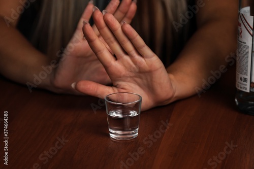 Young woman alcoholic social problems concept sitting refusal of alcohol