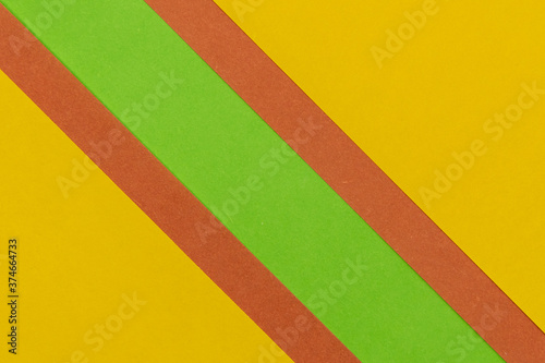 Green, Orange and Yellow coloured paper background