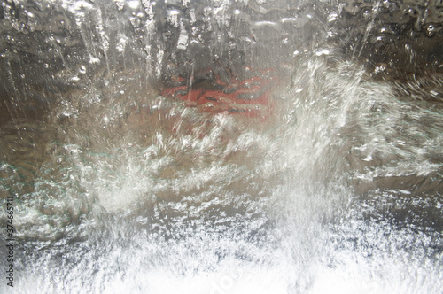 Abstract splashing water on glass © Payllik