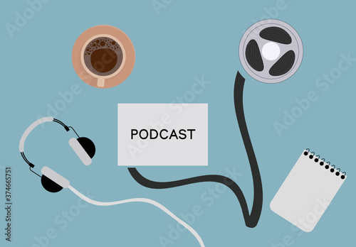 Podcast concept top view. Cup of coffee, film reel, headphone, notebook, podcast on the blue background. 
