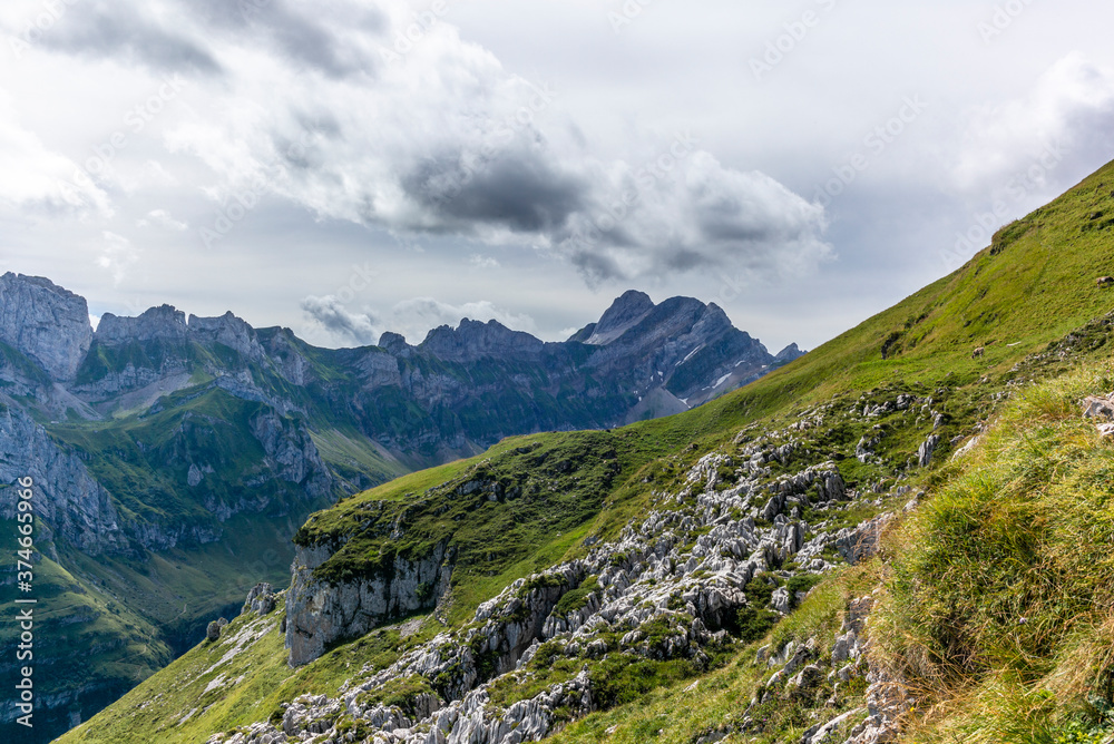 The  steep path leading to the majestic  Schaefler peak in the  Alpstein mountain range around the Aescher cliff in Appenzell, Switzerland