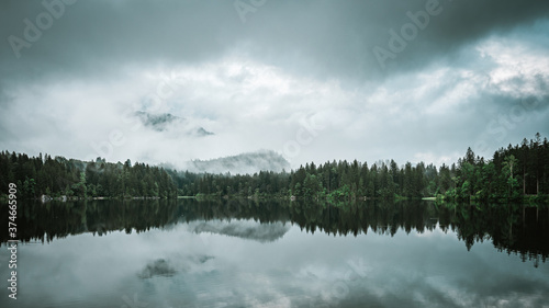 Epische Stimmung mit Morgennebel am Hintersee im Berchtesgadener Land. photo
