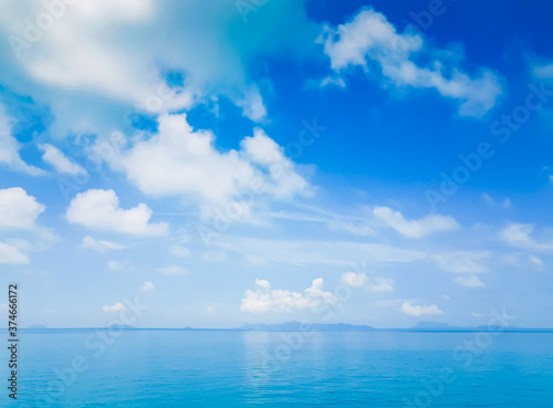 Blue sky with white cloud over turquise sea, scenic tropical seascape.
