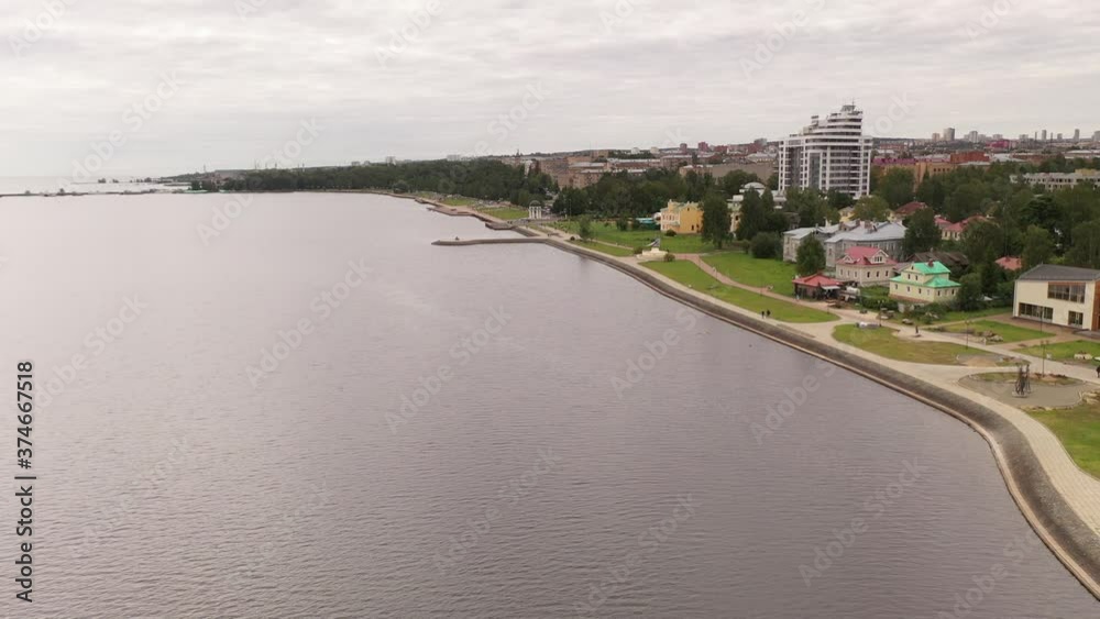 a panoramic view of the city embankment overlooking the lake filmed from a drone a panoramic view of the city embankment overlooking the lake filmed from a drone