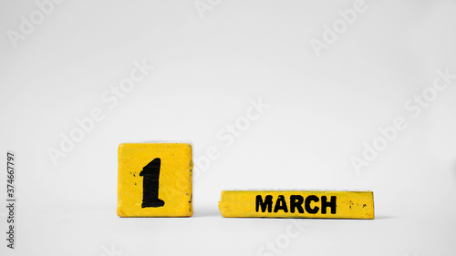 MARCH 1 Wooden calendar. Zero Discrimination Day. White background with space for your text.