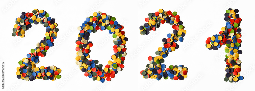 2021. New year, preparation for the holiday. numbers made of multicolored confetti on a white background. 2021. New year, preparation for the holiday. numbers made of multicolored confetti on a white background.