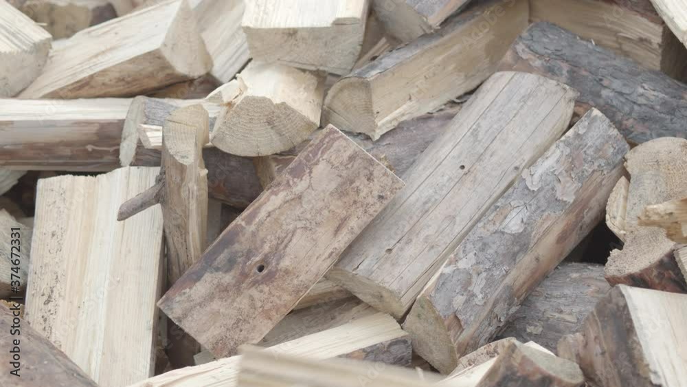 A man stacks firewood neatly to prepare for winter. ProRes 422 A man stacks firewood neatly to prepare for winter. ProRes 422