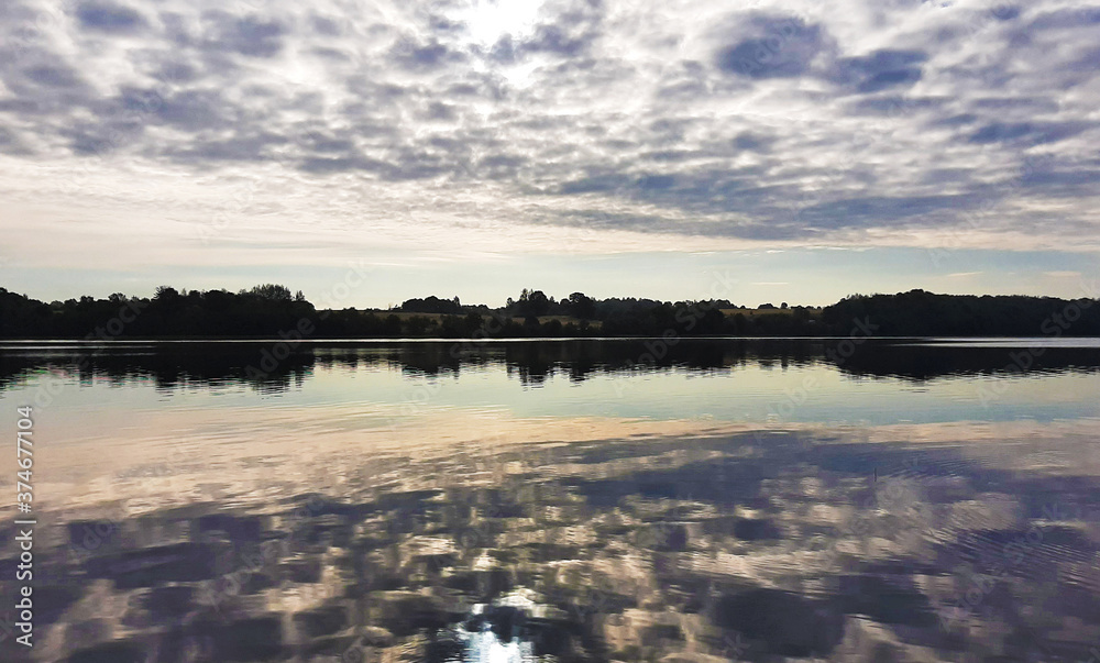 Fototapeta premium Beautiful contrasting sunset on the lake