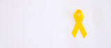 Suicide prevention and Childhood Cancer Awareness, Yellow Ribbon for supporting people living and illness. children Healthcare and World cancer day concept