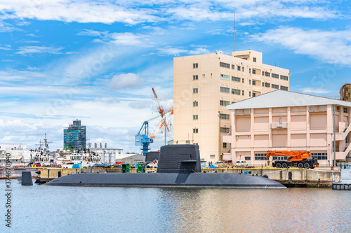 yokosuka, japan - july 19 2020: Close-up on the japanese submarine Takashio berthed in front of the japan maritime self-defense force Second Diving Group Command in the Yokosuka naval port. photo