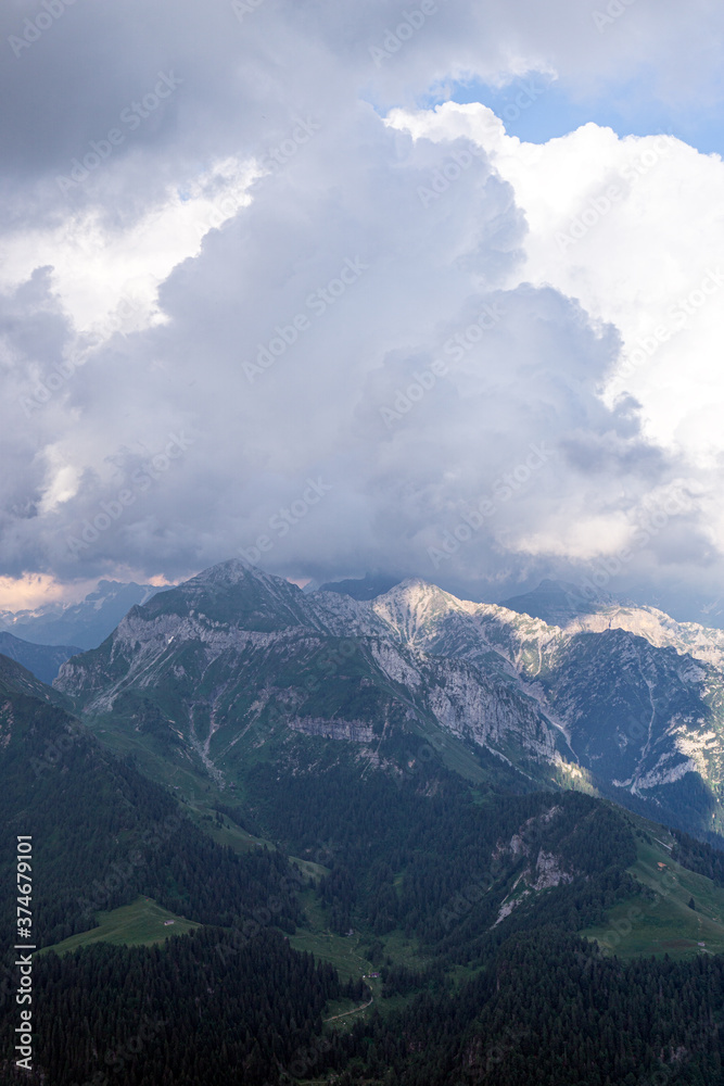 The meadows, the views and the peaks of the orobie alps during a summer afternoon, near the San Marco pass, Lombardy, Italy - June 2020