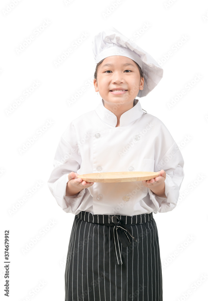 Happy Kid chef in uniform holding empty plate isolated Happy Kid chef in uniform holding empty plate isolated