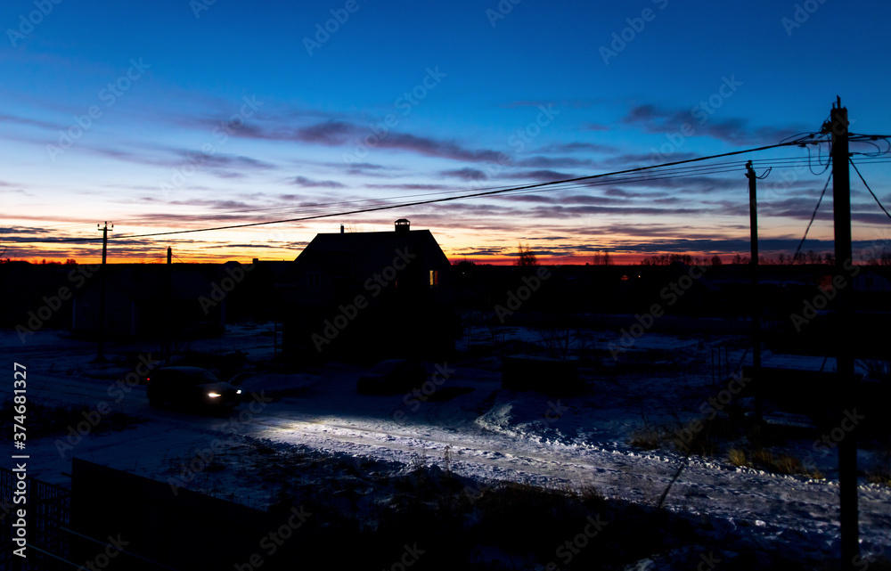 Fototapeta premium Dawn of the sun against a blue sky